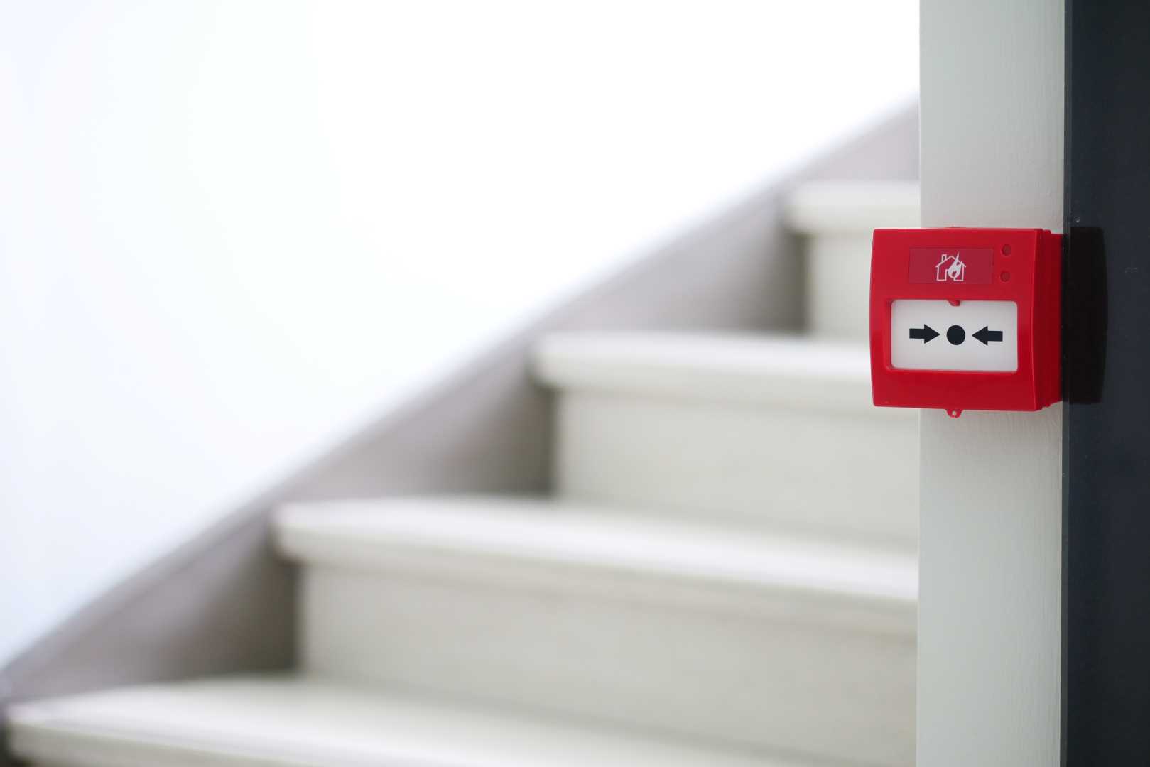 fire alarm next to stairs